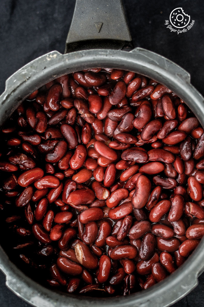 a close up of a pressure cooker of boiled rajma on a table