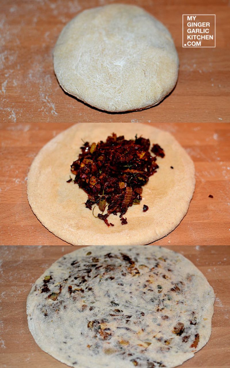 two uncooked red cabbage parathas on a wooden table
