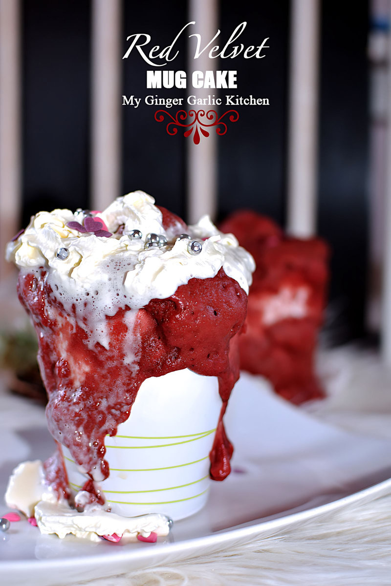 a red velvet mug cake with whipped cream and chocolate
