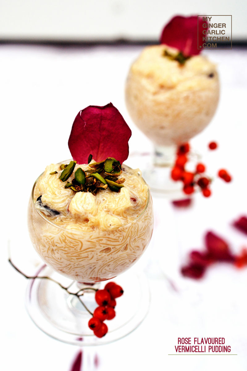 two glasses of rose flavoured vermicelli pudding with flowers on the table