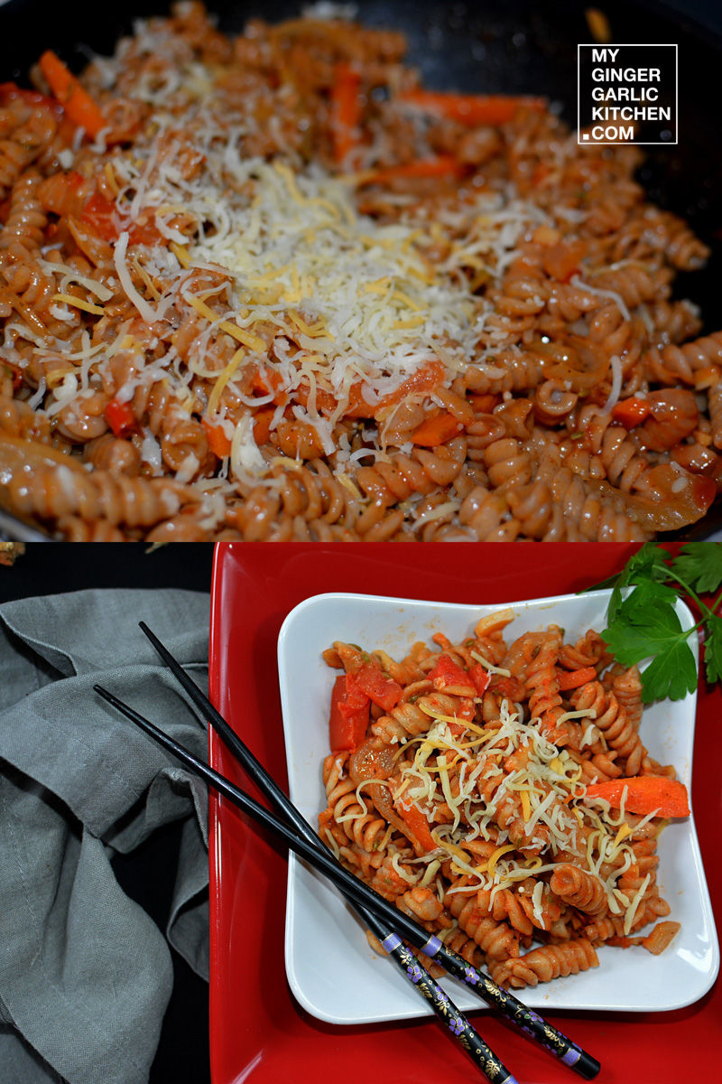 pasta with carrots and cheese in a pan