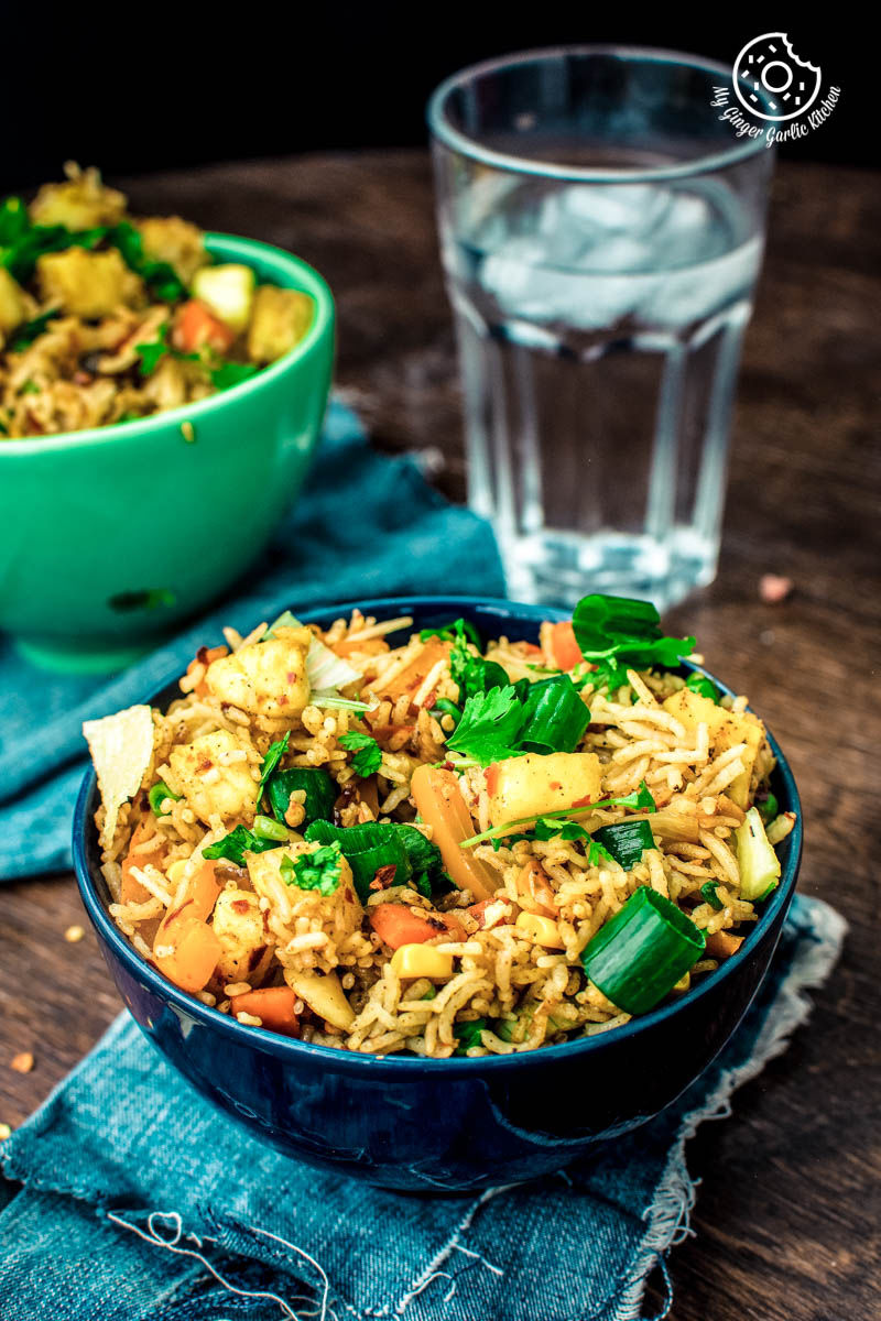 a bowl of thai pineapple fried rice vegan on a table