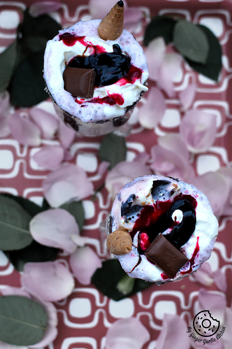 two valentine smoothies with chocolate and berries on them