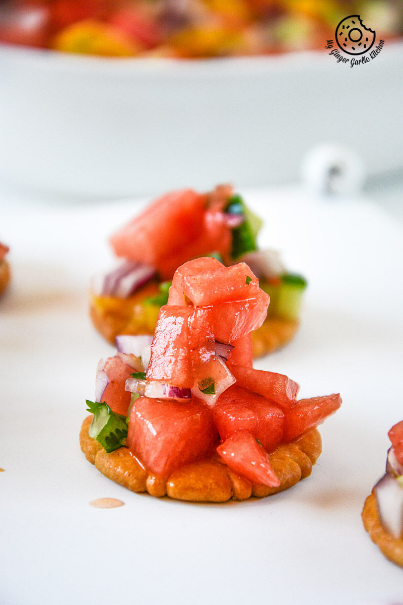 small appetizers with a variety of watermelon orange salsa on a plate