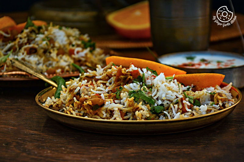 a plate of black eyed bean carrot biryani on a table