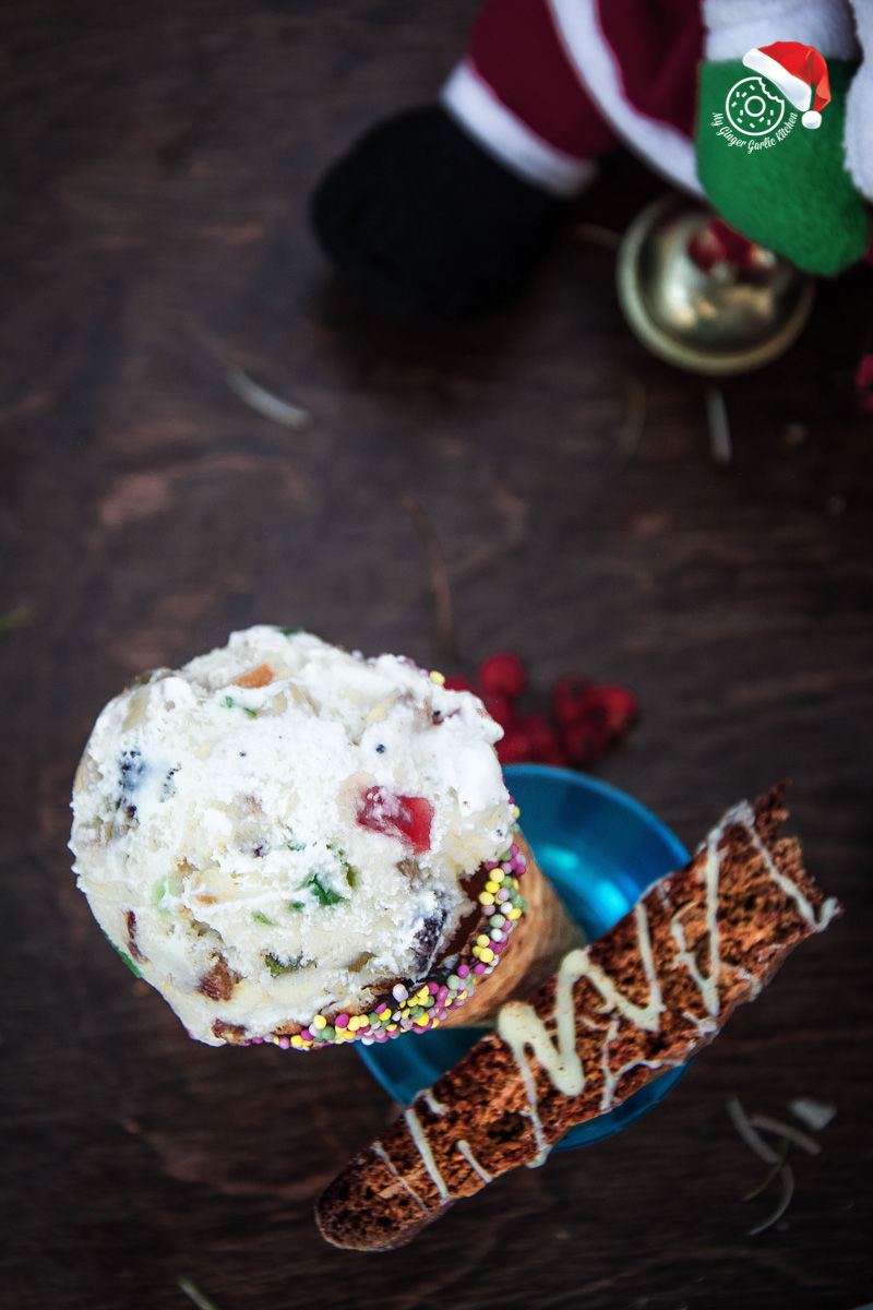 fruit and nut ice cream with and sprinkles and biscotti on a plate