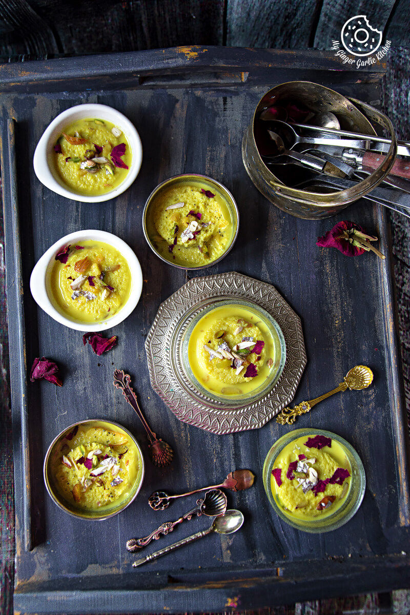 bowls of Instant Bread Ras Malai on a tray with spoons and spoons