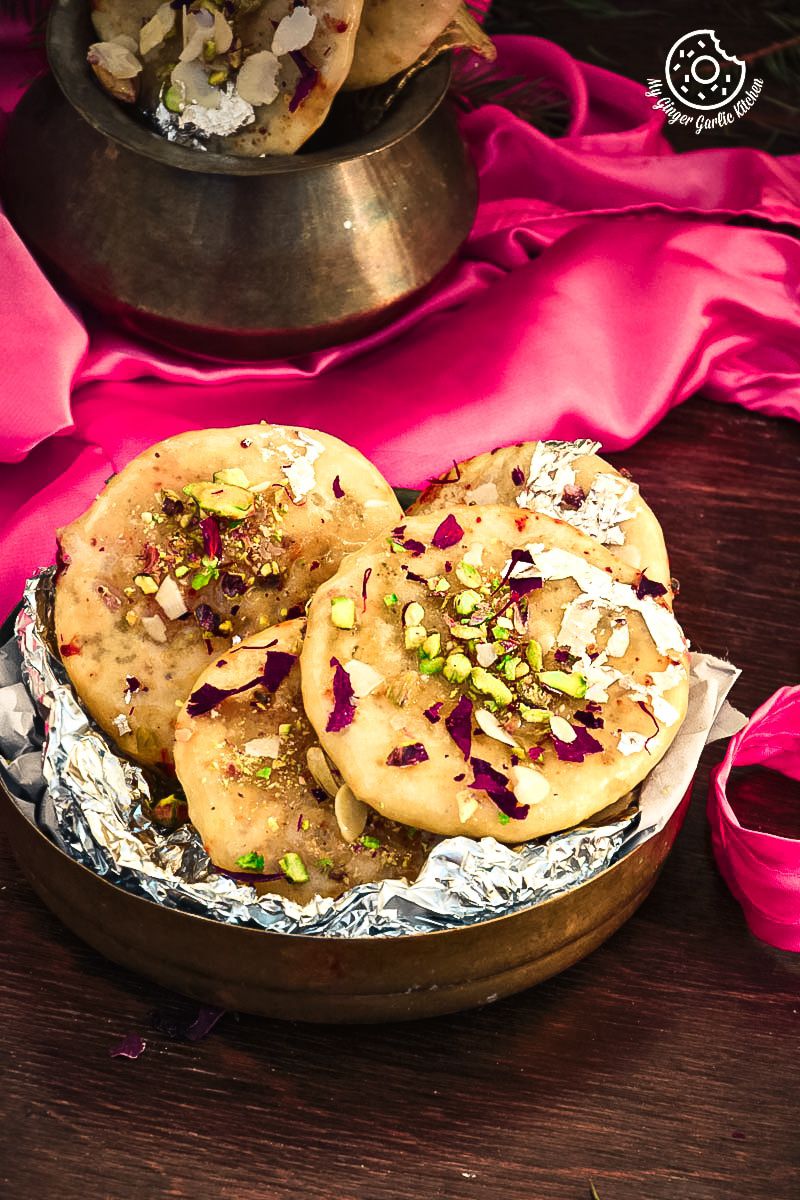 there are Jaipuri Mawa Kachoris on a plate with a pink cloth