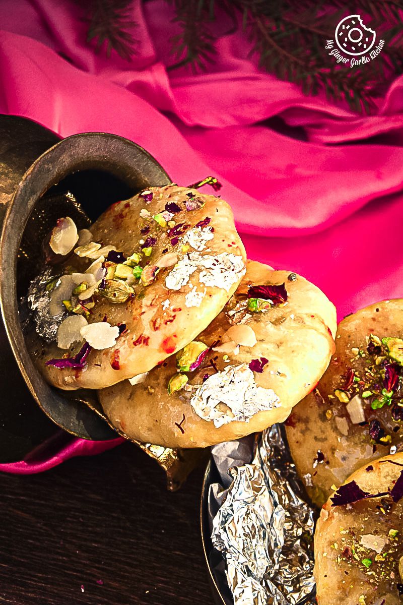 there are three some jaipuri mawa kachori on a table with a pink cloth