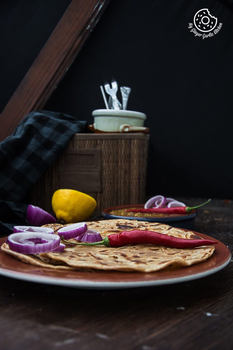 there is a plate of lachha paratha that is on a table