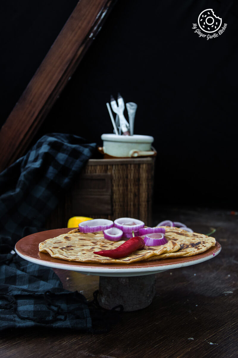 there is a plate with a plate of lachha paratha on it