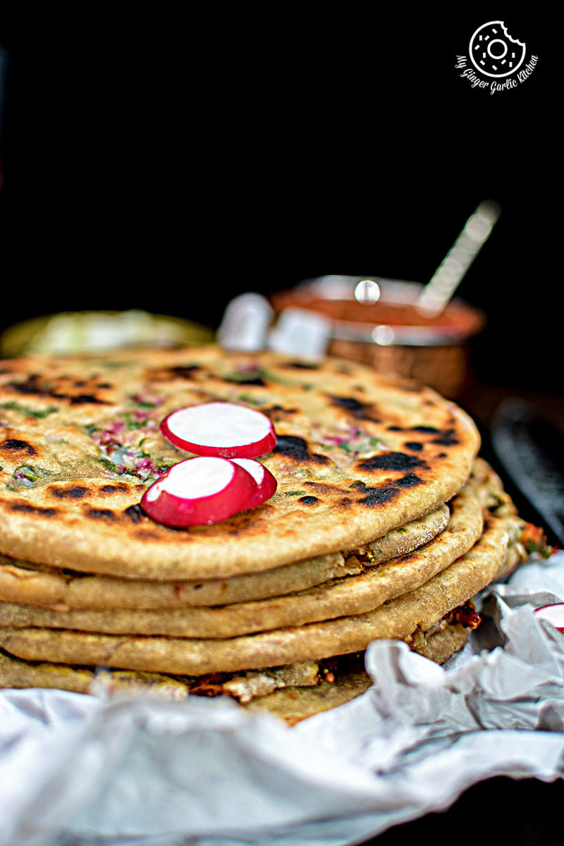 a stack of mooli paratha on a table