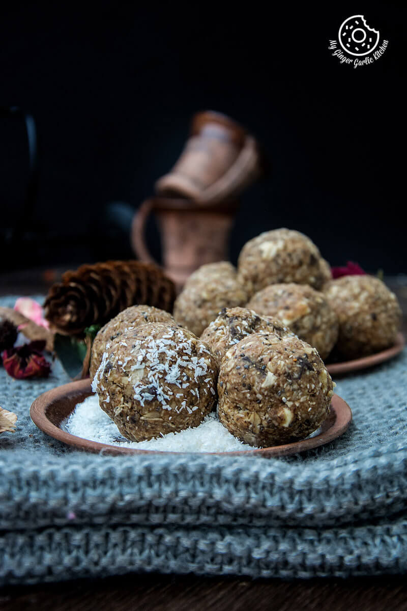 a plate of no bake oats and chia energy balls sitting on a table