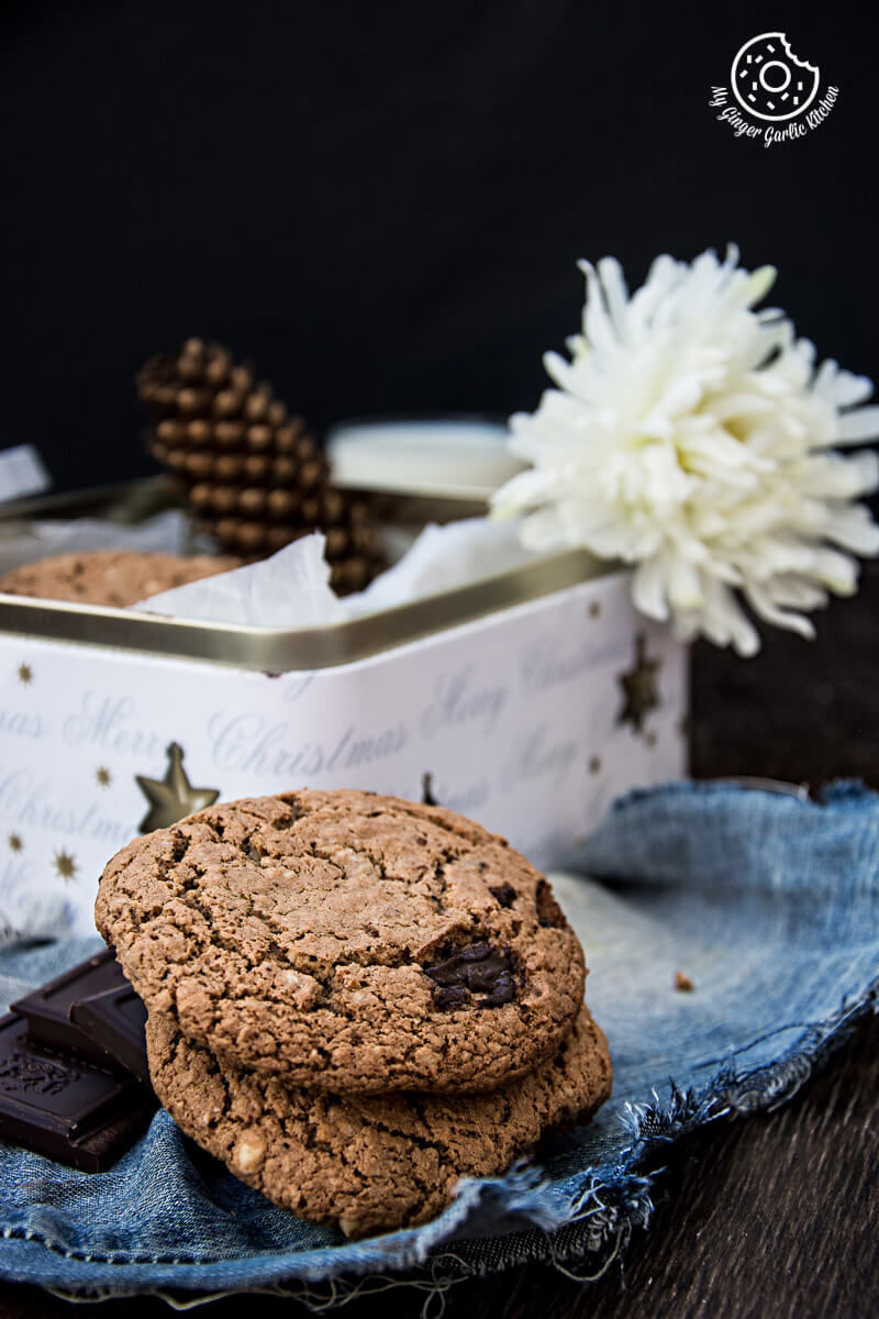 a oatmeal peanut butter chocolate cookies and chocolate on a plate with a flower