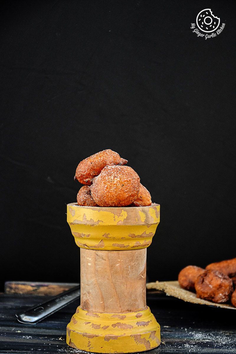 pumpkin fritters in a yellow cup on a table