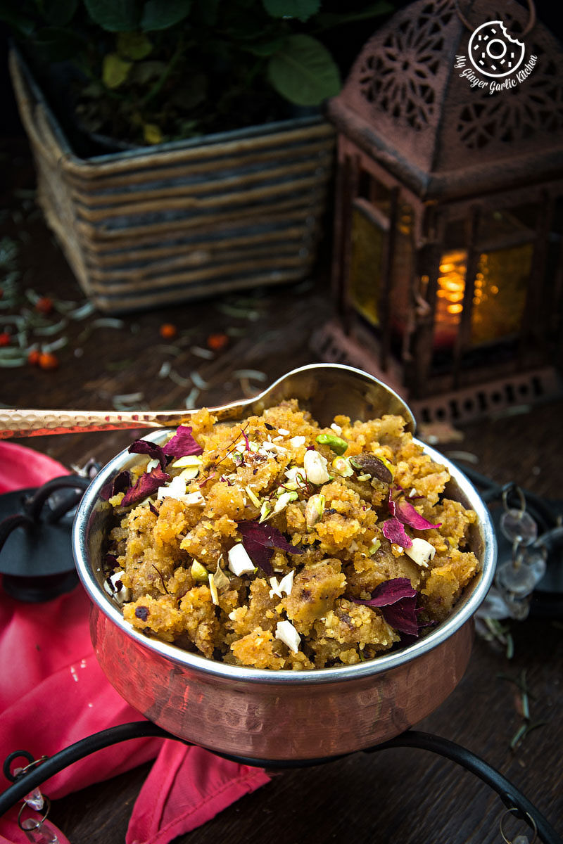 a bowl of rajasthani moong dal halwa with a spoon in it