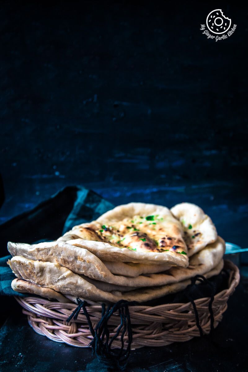 a stack of Restaurant Style Indian Garlic Naan on a table