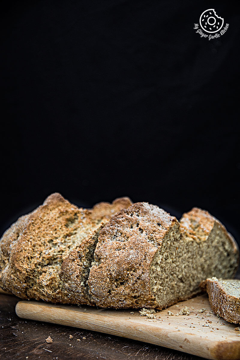 a loaf of rye irish soda bread on a cutting board