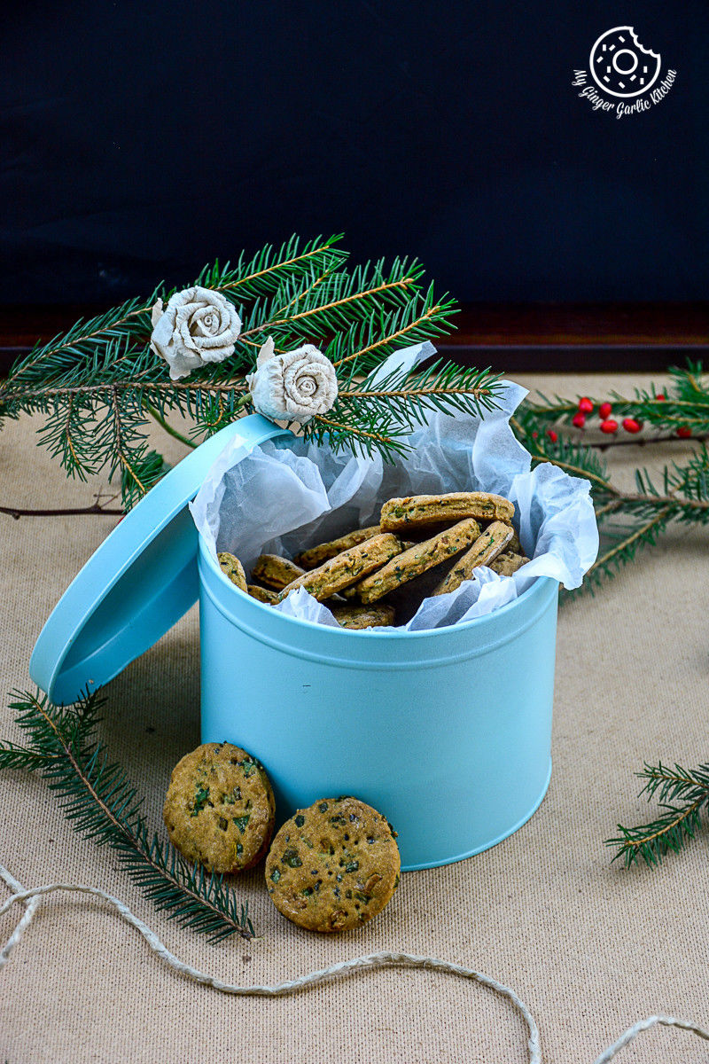 a blue tin with salty sweet whole wheat onion crackers in it on a table