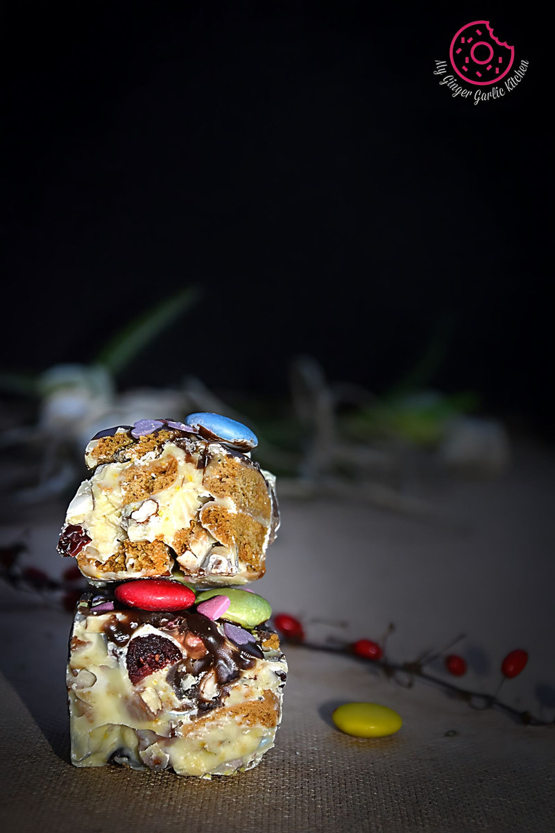 three pieces of white christmas rocky road stacked on top of each other