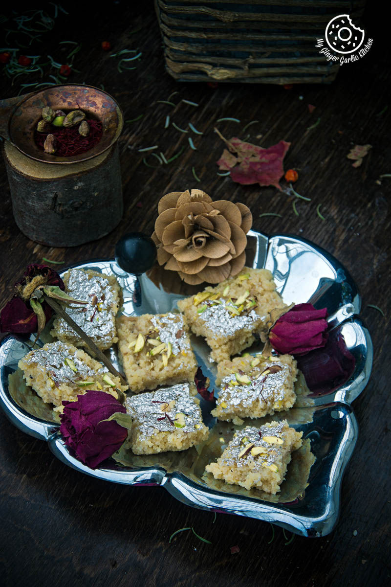 a plate of kopra pak or nariyal ki burfis that is on a table