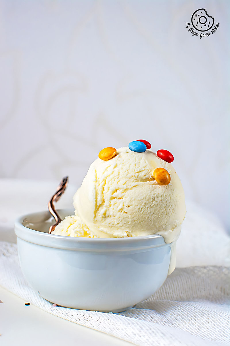 a bowl of no churn homemade vanilla icecream with candies on top