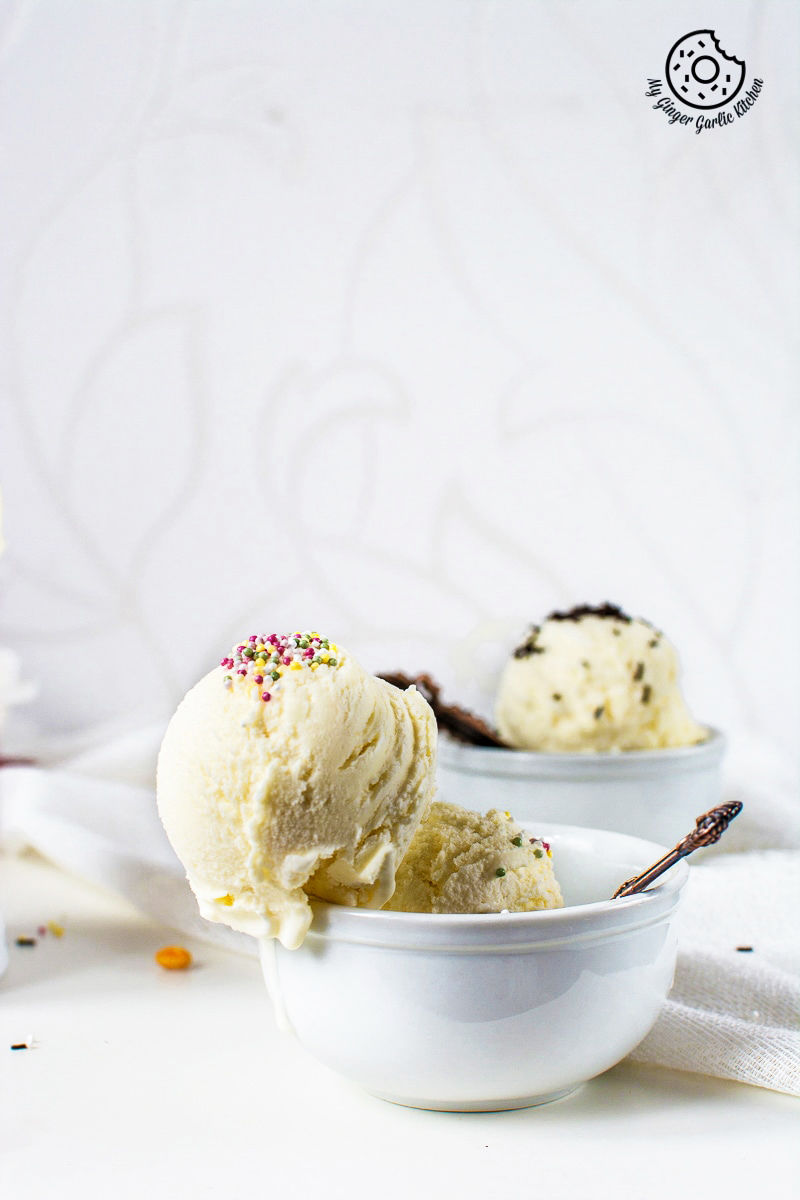 a bowl of ice cream with sprinkles and a spoon