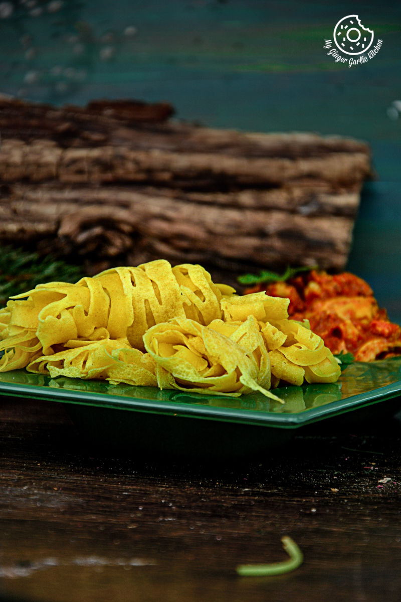 a plate of roti jala and other vegetables on a table