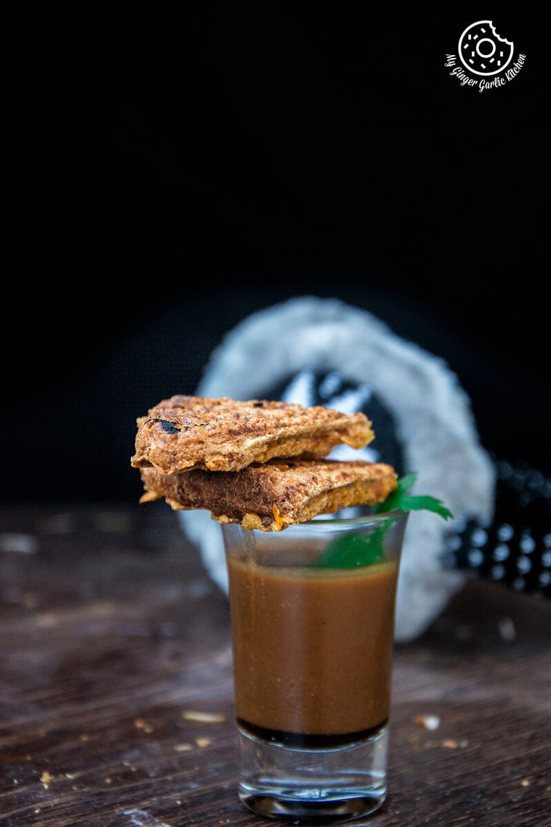 a shot of a dip with a sooji toast rava toast on top