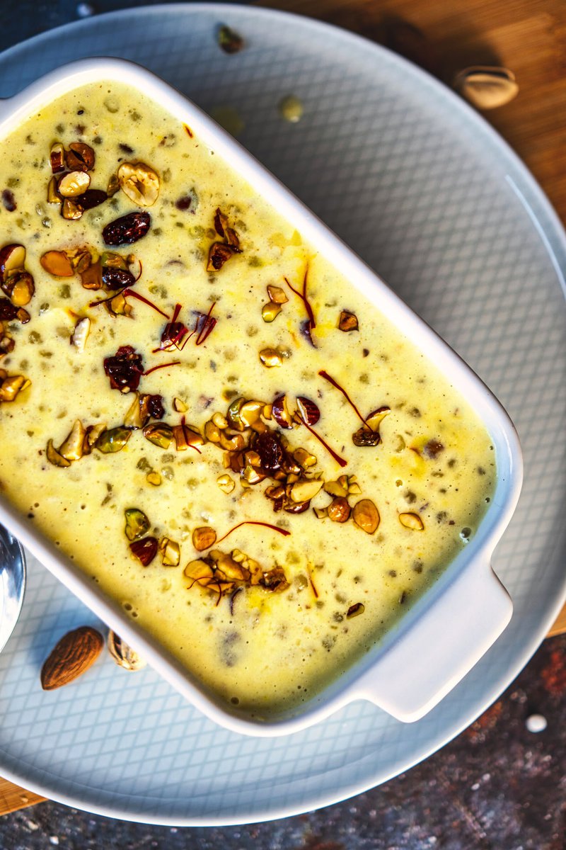 A bowl of Sabudana Kheer topped with nuts and saffron strands.