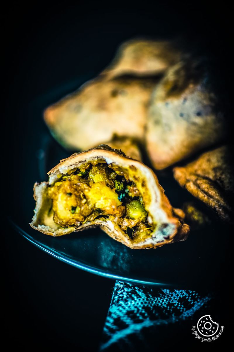 a closeup shot of aloo samosa broken into