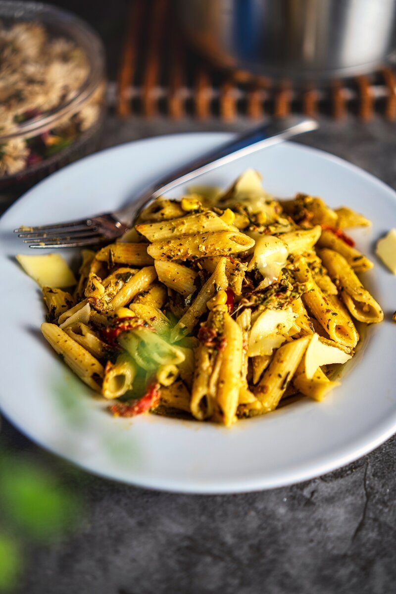 Homemade spinach sun-dried tomato pasta with corn and cheese, easy vegetarian dinner recipe