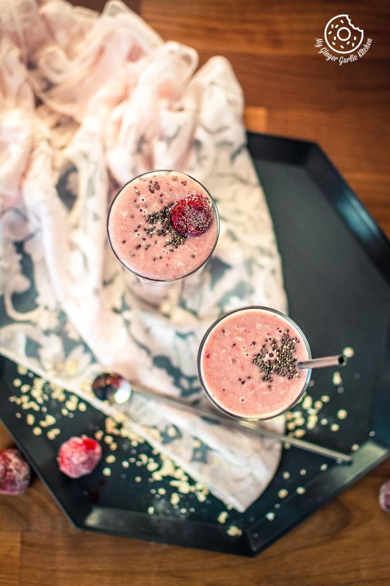 strawberry banana oat smoothie served in tall glasses