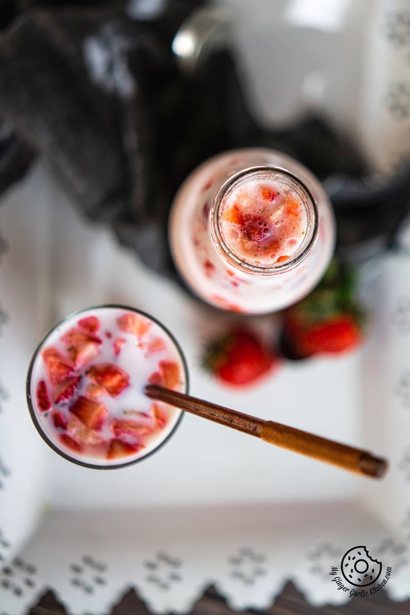 overhead shot of korean strawberry milk bottle and strawberry milk glass