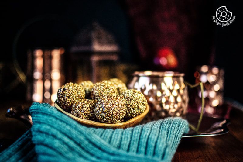 til laddu bowl kept on a grey woolen fabric