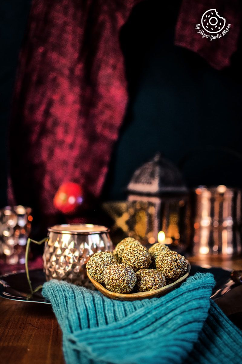 sesame ladoo is served in a wooden bowl