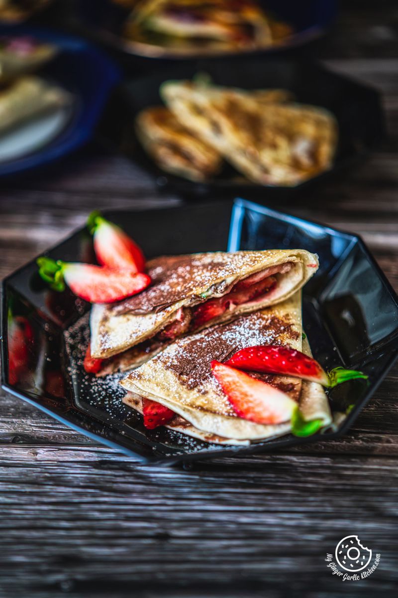 strawberry nutella tortilla wrap served in a black plate