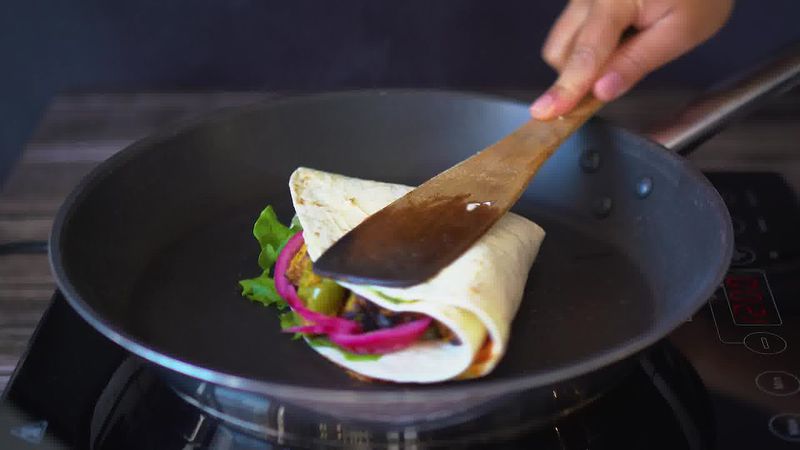 Image of the recipe cooking step-2-7 for TikTok Tortilla Wrap Hack (6 Vegetarian Filling Ideas)