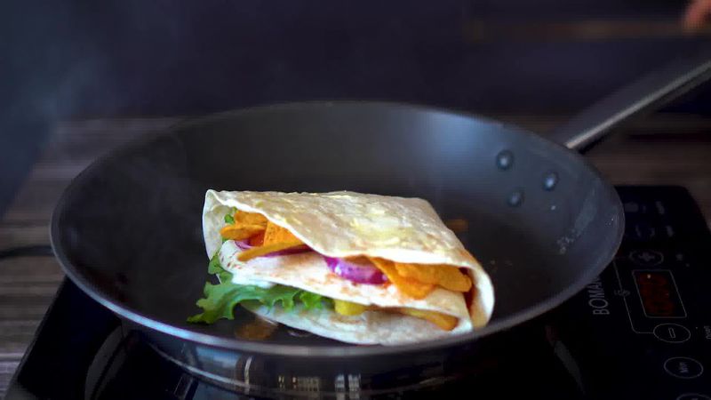 Image of the recipe cooking step-3-7 for TikTok Tortilla Wrap Hack (6 Vegetarian Filling Ideas)