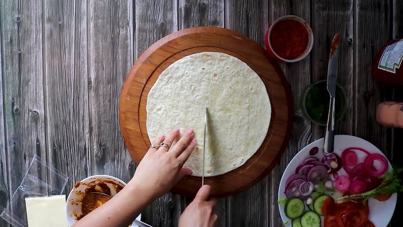 Image of the recipe cooking step-4-1 for TikTok Tortilla Wrap Hack (6 Vegetarian Filling Ideas)