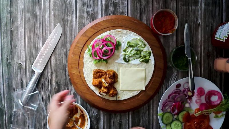Image of the recipe cooking step-4-5 for TikTok Tortilla Wrap Hack (6 Vegetarian Filling Ideas)