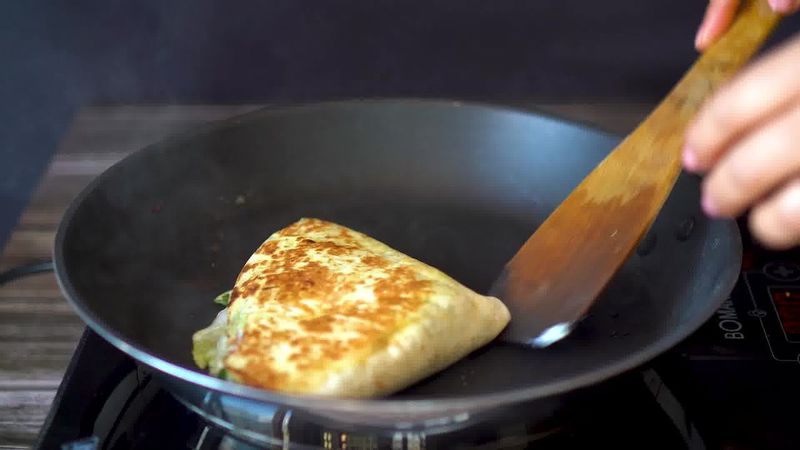 Image of the recipe cooking step-4-7 for TikTok Tortilla Wrap Hack (6 Vegetarian Filling Ideas)