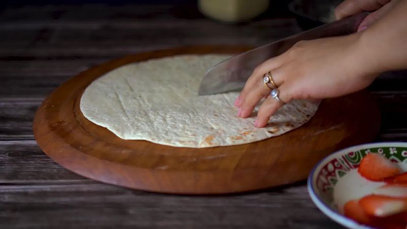 Image of the recipe cooking step-5-1 for TikTok Tortilla Wrap Hack (6 Vegetarian Filling Ideas)