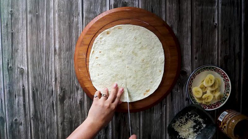 Image of the recipe cooking step-6-1 for TikTok Tortilla Wrap Hack (6 Vegetarian Filling Ideas)
