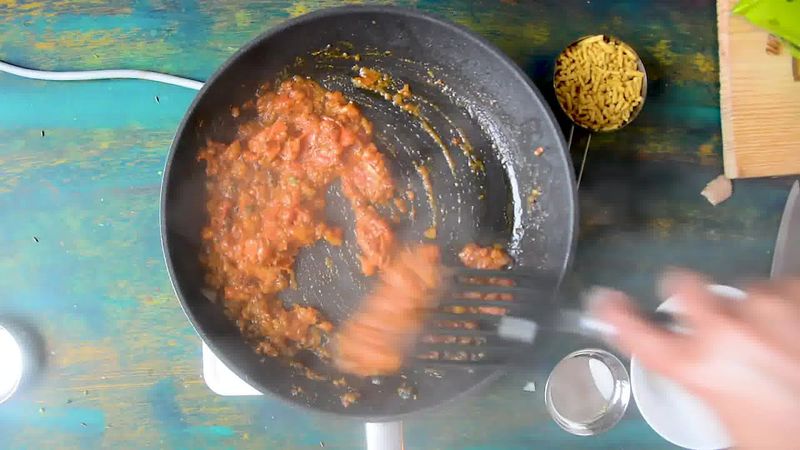 Image of the recipe cooking step-1-7 for Traditional Rajasthani Sev Tamatar Ki Sabzi