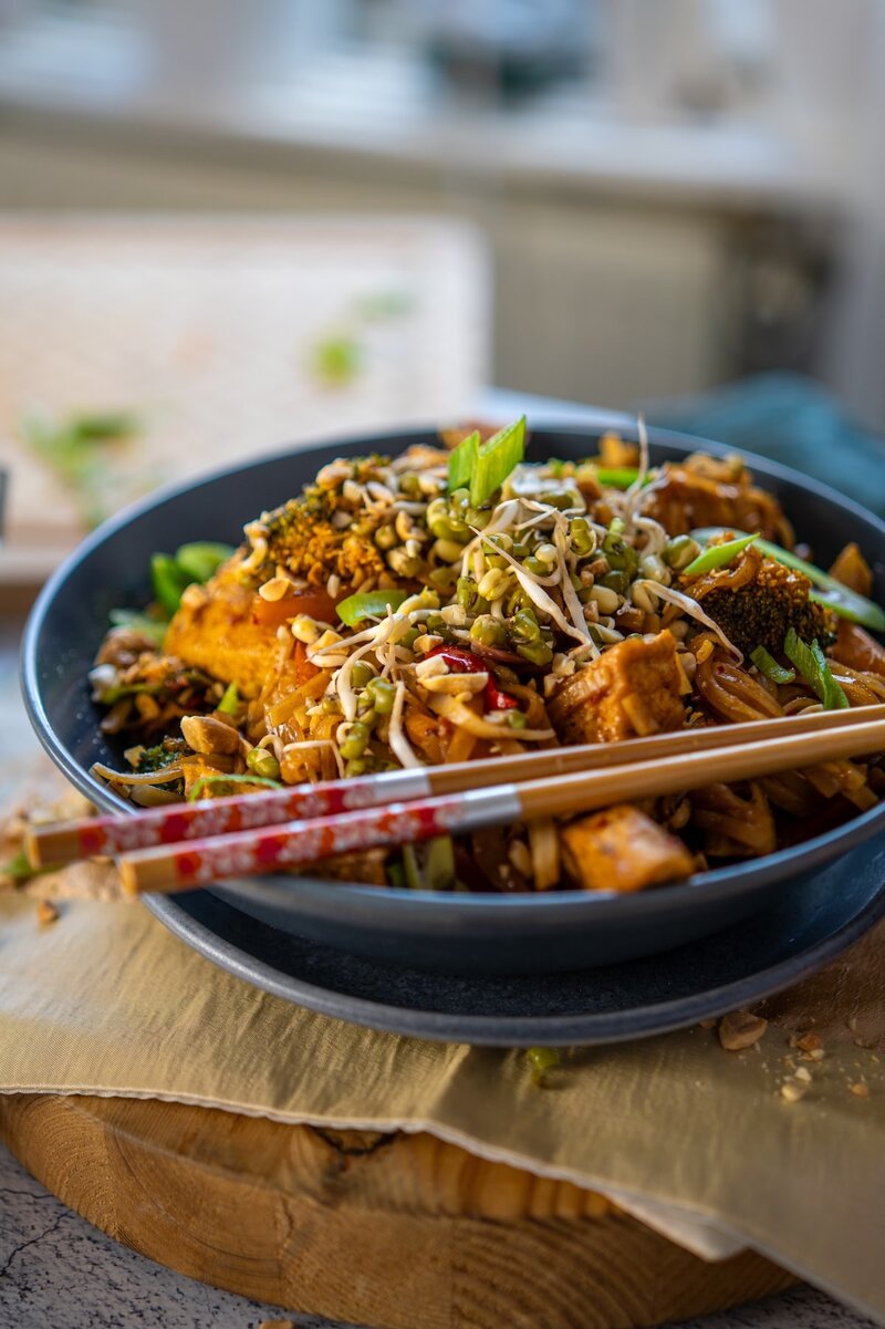 Easy vegan Pad Thai with tofu, colorful vegetables, and tamarind sauce, authentic Thai noodles for a healthy plant based meal.