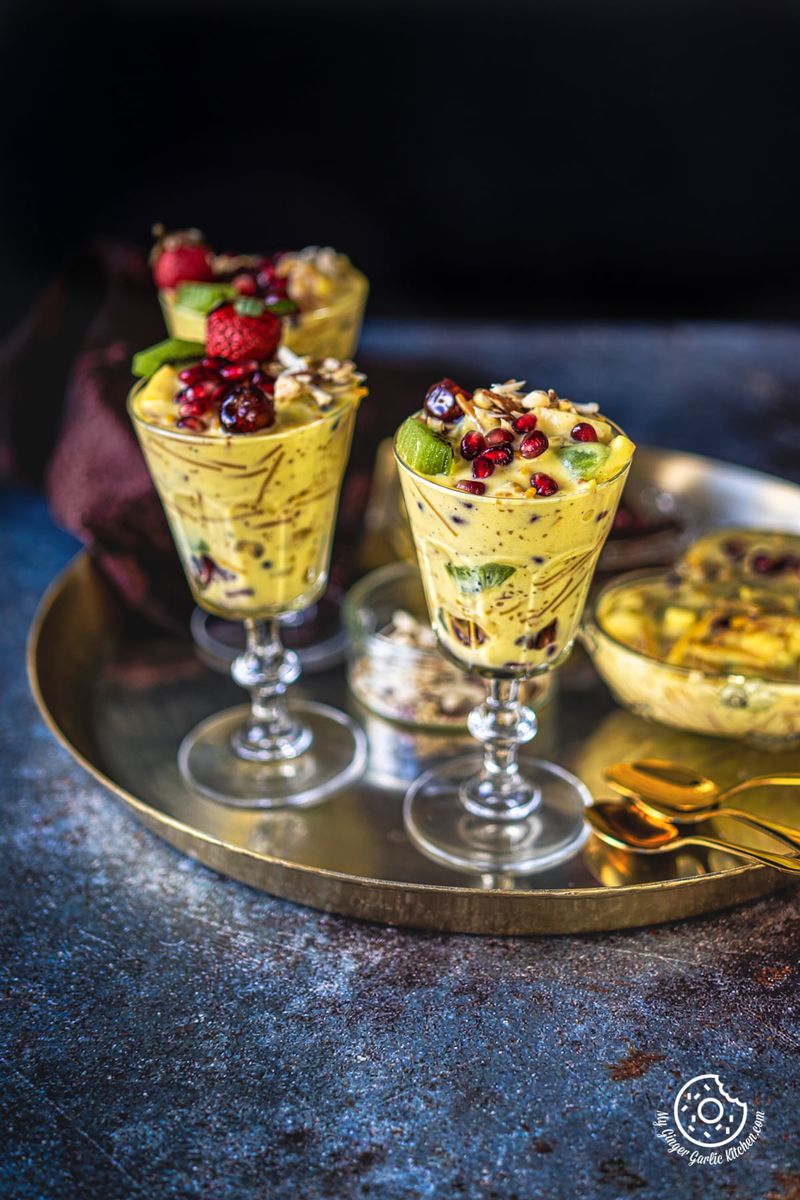 three vermicelli fruit custard glasses in a golden plate