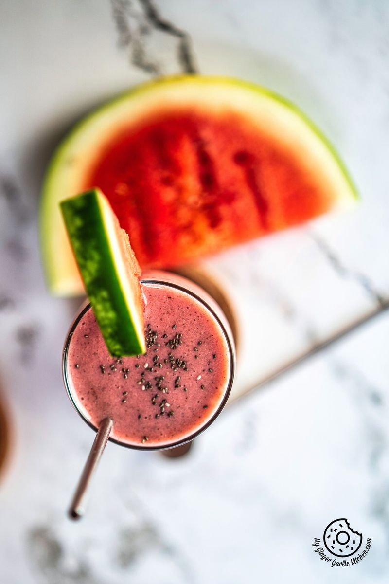 overhead shot of watermelon smoothie with chia and a watermelon slice in the background