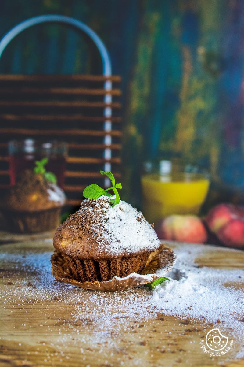 whole wheat peach muffin topped with mint leaves